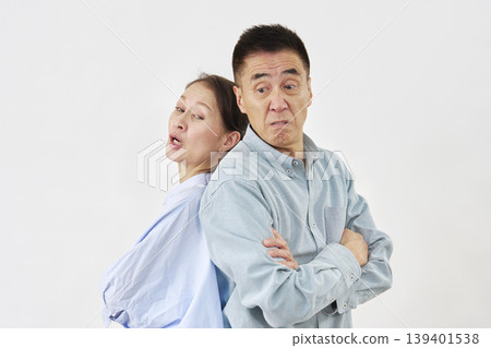 Senior couple fighting on white background Senior couple fighting on white background 139401538