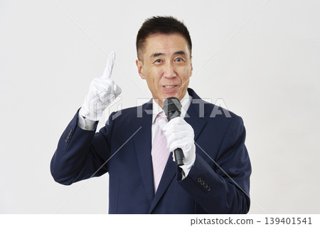 Male candidate giving a speech against a white background Male candidate giving a speech against a white background 139401541