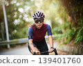 outdoor portrait of young female asian cyclist 139401760