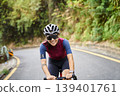 young asian woman riding bike outdoors 139401761