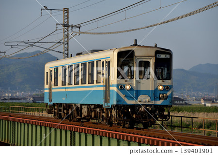 A single Kiha 32 series local train running on the Yosan Line A single Kiha 32 series local train running on the Yosan Line 139401901