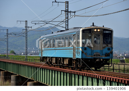 A single Kiha 54 series local train running on the Yosan Line A single Kiha 54 series local train running on the Yosan Line 139401906