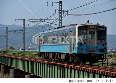 A single Kiha 54 series local train running on the Yosan Line A single Kiha 54 series local train running on the Yosan Line 139401912