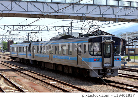 Two 7000 series train cars waiting on a siding. Two 7000 series train cars waiting on a siding. 139401937