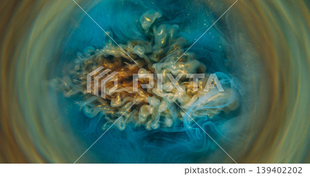 Blur paint flow. Fume water. Defocused blue yellow golden color sparkling swirling liquid mist circle floating on abstract background. Blur paint flow. Fume water. Defocused blue yellow golden color sparkling swirling liquid mist circle floating on abstract background. 139402202