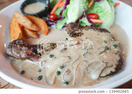 pork steak or grilled pork and salad or pork chop and vegetable pork steak or grilled pork and salad or pork chop and vegetable 139402665