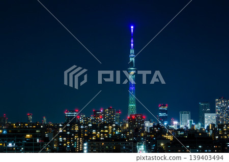 Tokyo Skytree, shining brightly against the night view: A stunning nighttime view of Tokyo 139403494