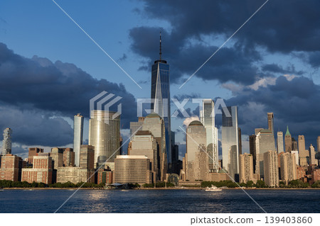 New York city of America. Skyscraper building of NYC. NY city architecture. Midtown Manhattan at Hudson river. Sunset city. Cityscape in sunrise. New York downtown. Manhattan skyline. Dramatic sky New York city of America. Skyscraper building of NYC. NY city architecture. Midtown Manhattan at Hudson river. Sunset city. Cityscape in sunrise. New York downtown. Manhattan skyline. Dramatic sky 139403860
