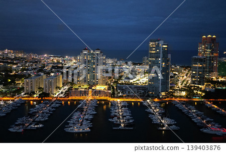 Luxury South beach marina. Luxury yacht at night. Miami south beach view. Yacht club. Marina in night Miami. Downtown Miami marina with luxury illuminated yacht. Summer vacation. Marina lights 139403876