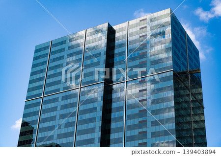 City downtown with skyscraper. Office building in business district. Skyscraper building architecture. Business skyscraper of glass. Modern glass building. Skyscraper in city downtown. Soaring height 139403894