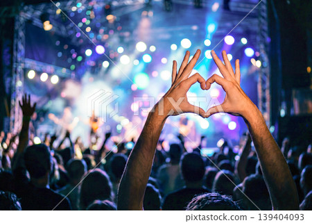 Audience members' hands forming a heart shape at the live venue Audience members' hands forming a heart shape at the live venue 139404093