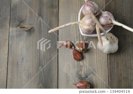 Garlic purple on grey background with copyspace. Garlic purple on grey background with copyspace. 139404519