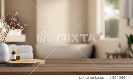 Serum skincare and diffuser on round log tray with white towels on wooden counter table in bathroom. 139404944
