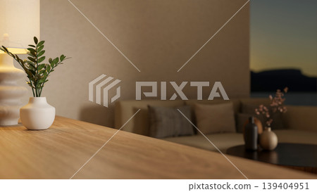 Close up a potted plant on wooden counter table across sofa couch and wall window in dim living room Close up a potted plant on wooden counter table across sofa couch and wall window in dim living room 139404951
