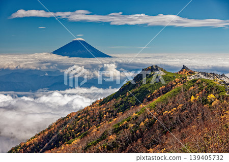 Autumn foliage on Mt. Yakushi and Mt. Fuji above the clouds, as seen from Mt. Kannon in the Southern Alps, Houou Sanzan. 139405732