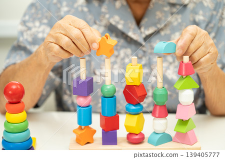 Asian elderly woman patient learn practical motor skills. Asian elderly woman patient learn practical motor skills. 139405777