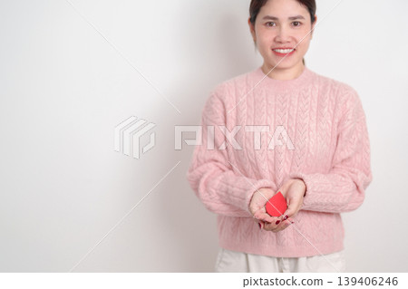 Adult woman with red Blood drop paper for concept of June World Blood Donor day, Donation, April Hemophilia awareness day, May Thalassemia Day, Anemia awareness, June Sickle Cell and Blood Disorders Adult woman with red Blood drop paper for concept of June World Blood Donor day, Donation, April Hemophilia awareness day, May Thalassemia Day, Anemia awareness, June Sickle Cell and Blood Disorders 139406246