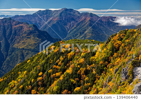Autumn foliage in the Southern Alps, Mount Senjōgatake as seen from the Yakushidake ridge of the Hōō Sanzan mountain range. 139406440