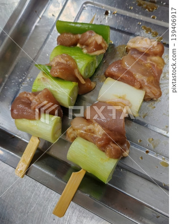 Raw Yakitori Negima Chicken and Green Onion Skewers Prepared for Grilling Raw Yakitori Negima Chicken and Green Onion Skewers Prepared for Grilling 139406917