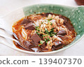 Fresh rice noodles with spicy pork soup in a bowl northern of thailand style cuisine. Thai food is Kanom Jeen Nam Ngeaw 139407370