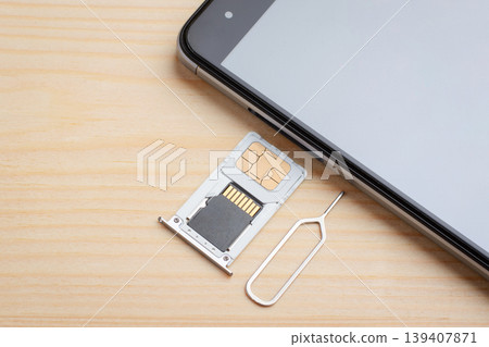 Inserting tray for SIM card and memory drive to the mobile phone. Expanding memory in a mobile phone Inserting tray for SIM card and memory drive to the mobile phone. Expanding memory in a mobile phone 139407871