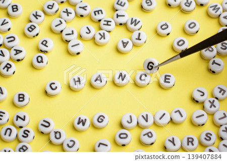 Tweezers puts letter G instead of letter C in word CHANCE. Word CHANCE made of white plastic blocks on a white background. Concept of personal development and career growth Tweezers puts letter G instead of letter C in word CHANCE. Word CHANCE made of white plastic blocks on a white background. Concept of personal development and career growth 139407884
