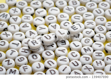Word RULE made of round plastic blocks laying on other round blocks on a yellow background. Symbol of precedence of constitution, rules Word RULE made of round plastic blocks laying on other round blocks on a yellow background. Symbol of precedence of constitution, rules 139407890