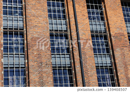 Red Brick Industrial Building Facade With Windows Red Brick Industrial Building Facade With Windows 139408507