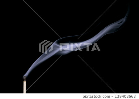 Smoke from a put out match isolated on black background Smoke from a put out match isolated on black background 139408668
