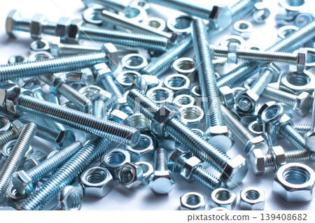 Bolts and nuts of different size isolated on white background 139408682
