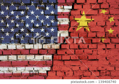Flags of United States and China on the brick wall with big crack in the middle. Symbol of problems between countries 139408740