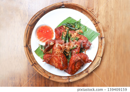 chicken wings or deep fried chicken , fried chicken and sauce chicken wings or deep fried chicken , fried chicken and sauce 139409159