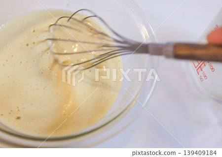 Making custard cream: Add milk and mix. Making custard cream: Add milk and mix. 139409184