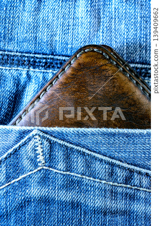 Brown Leather Wallet in Jeans Pocket. Close Up Casual Lifestyle Detail Brown Leather Wallet in Jeans Pocket. Close Up Casual Lifestyle Detail 139409662