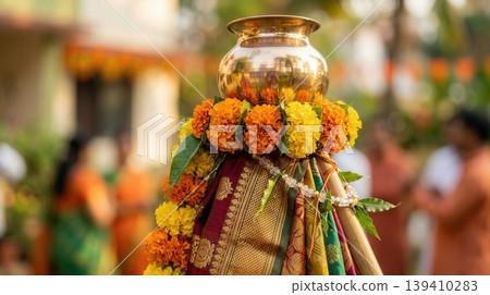 Detailed Gudi decoration in focus with soft blurred street behind. Representation of Hindu New Year celebration in modern city life. Detailed Gudi decoration in focus with soft blurred street behind. Representation of Hindu New Year celebration in modern city life. 139410283