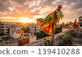 Traditional Gudi on roof terrace moving in gentle breeze at sunrise. Representation of Hindu New Year and peaceful festive atmosphere. 139410288