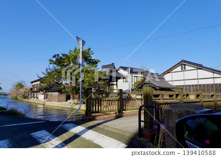 A view of Chomeiji Temple from the foot of the bridge over the Kumitani River in Kumihama Bay, Kumihama-cho, Kyotango City, Kyoto Prefecture. A view of Chomeiji Temple from the foot of the bridge over the Kumitani River in Kumihama Bay, Kumihama-cho, Kyotango City, Kyoto Prefecture. 139410588