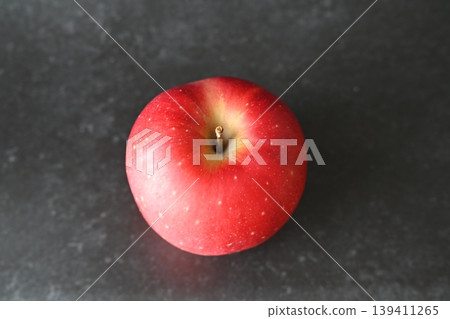 A bright red apple viewed from directly above (on a black background) A bright red apple viewed from directly above (on a black background) 139411265