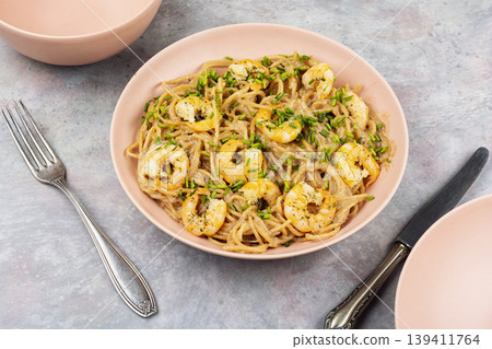 Creamy shrimp pasta with spaghetti and herbs Creamy shrimp pasta with spaghetti and herbs 139411764