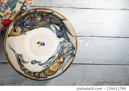 Okinawan traditional craft: Yachimun fish pattern plate Okinawan traditional craft: Yachimun fish pattern plate 139411798