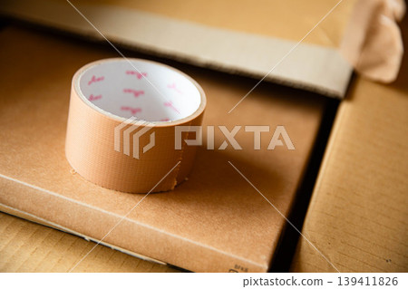 Cardboard and packing tape Cardboard and packing tape 139411826