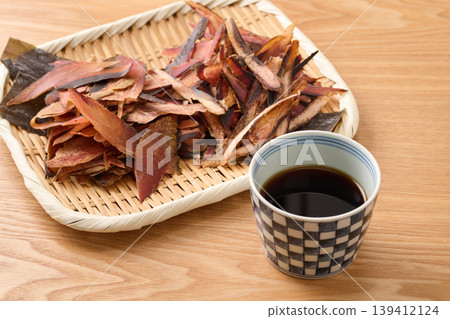 Soba dipping sauce, two types of dried bonito flakes (katsuobushi and soda bonito flakes), and Rausu kelp. Soba dipping sauce, two types of dried bonito flakes (katsuobushi and soda bonito flakes), and Rausu kelp. 139412124