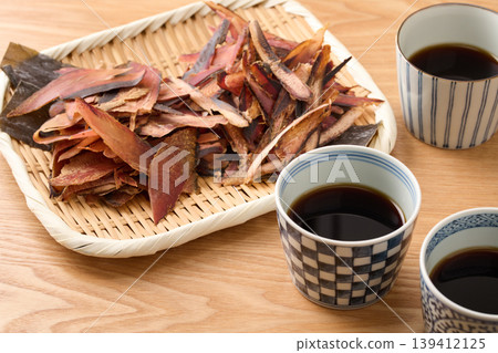 Soba dipping sauce, two types of dried bonito flakes (katsuobushi and soda bonito flakes), and Rausu kelp. Soba dipping sauce, two types of dried bonito flakes (katsuobushi and soda bonito flakes), and Rausu kelp. 139412125