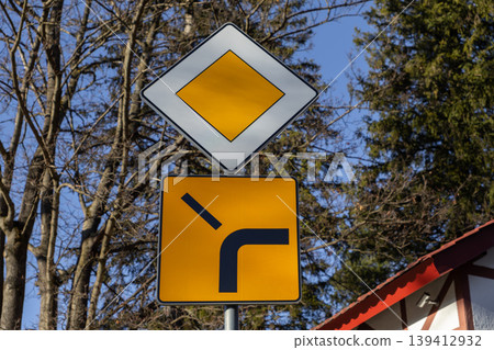 Essential traffic signs for priority road and right turn, providing crucial visual guidance for drivers navigating road rules and ensuring travel safety Essential traffic signs for priority road and right turn, providing crucial visual guidance for drivers navigating road rules and ensuring travel safety 139412932