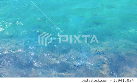 Transparent sea and water surface ripple texture photo Transparent sea and water surface ripple texture photo 139413084