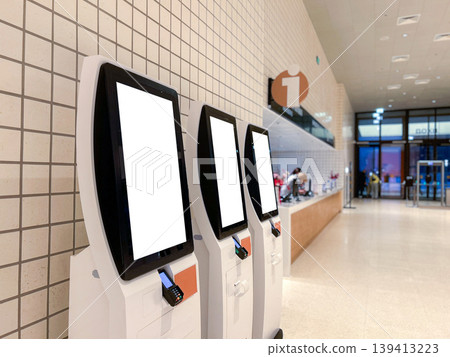 Self service terminal in Mall, shop, market airport. Modern technologies and displacement of manual labor Self service terminal in Mall, shop, market airport. Modern technologies and displacement of manual labor 139413223