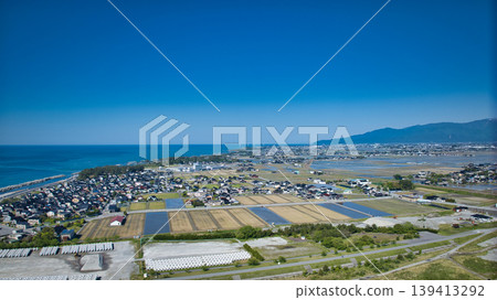 A view from around the mouth of the Kurobe River in May, the rice planting season. A view from around the mouth of the Kurobe River in May, the rice planting season. 139413292