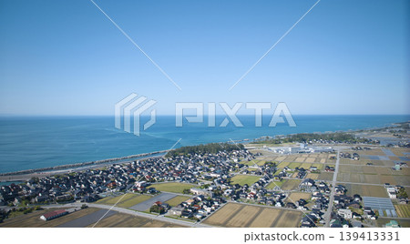 A view from around the mouth of the Kurobe River in May, the rice planting season. A view from around the mouth of the Kurobe River in May, the rice planting season. 139413331