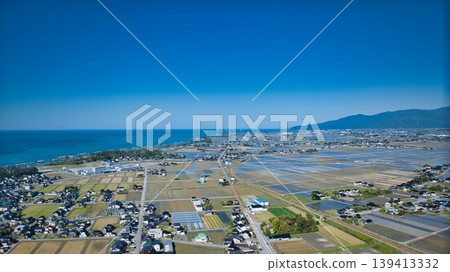 A view from around the mouth of the Kurobe River in May, the rice planting season. A view from around the mouth of the Kurobe River in May, the rice planting season. 139413332