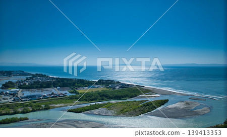 A view from around the mouth of the Kurobe River in May, the rice planting season. A view from around the mouth of the Kurobe River in May, the rice planting season. 139413353